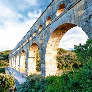 Side view of Pont du Gard and tourists path